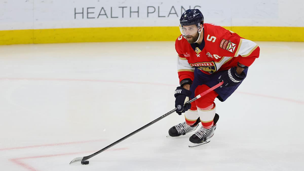Florida Panthers defenseman Aaron Ekblad (5) moves the puck against the New York Islanders during the first period at Amerant Bank Arena
