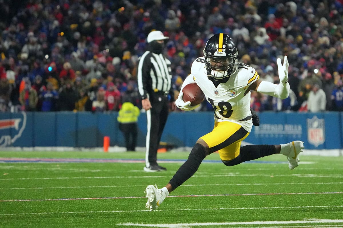 Pittsburgh Steelers wide receiver Diontae Johnson (18) runs the ball in the second half against the Buffalo Bills in a 2024 AFC wild card game at Highmark Stadium