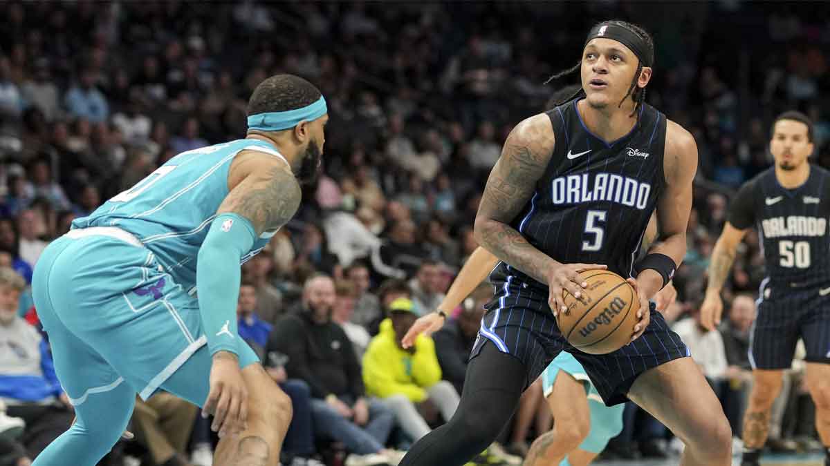 Orlando Magic forward Paolo Banchero (5) stops and looks for a shot defended by Charlotte Hornets forward Miles Bridges (0) during the second quarter at Spectrum Center