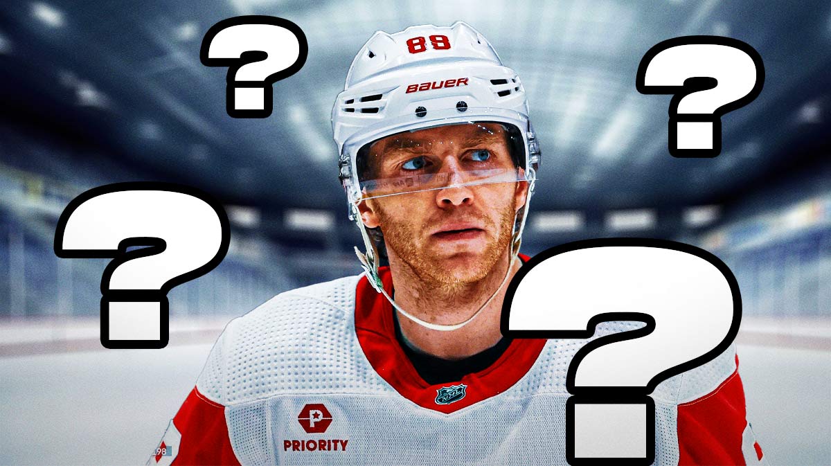 Patrick Kane looking thoughtful in middle of image, 3-5 question marks, hockey rink in background, Detroit Red Wings logo