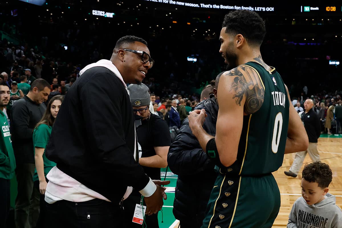 Boston Celtics forward Jayson Tatum (0) talks with former Celtics great Paul Pierce after they defeated the Philadelphia 76ers at TD Garden.