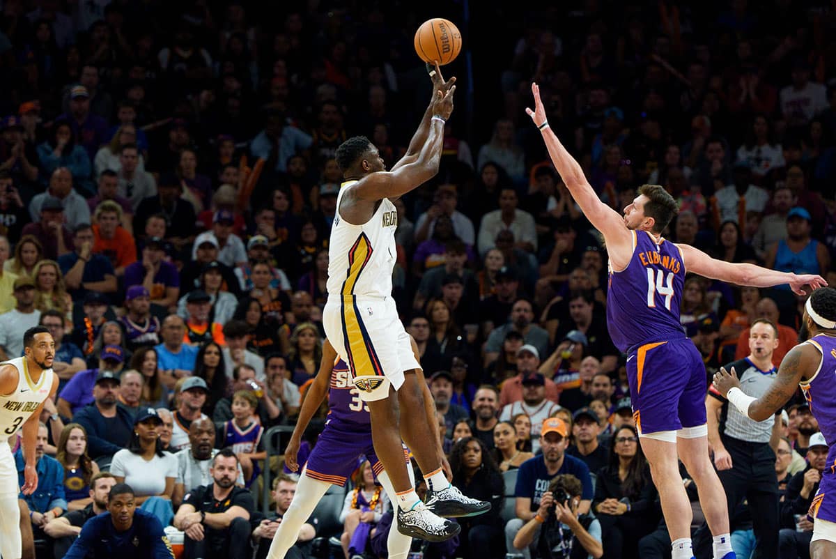 New Orleans Pelicans forward Zion Williamson (1) shoots over Phoenix Suns forward-center Drew Eubanks (14) in the second half at Footprint Center