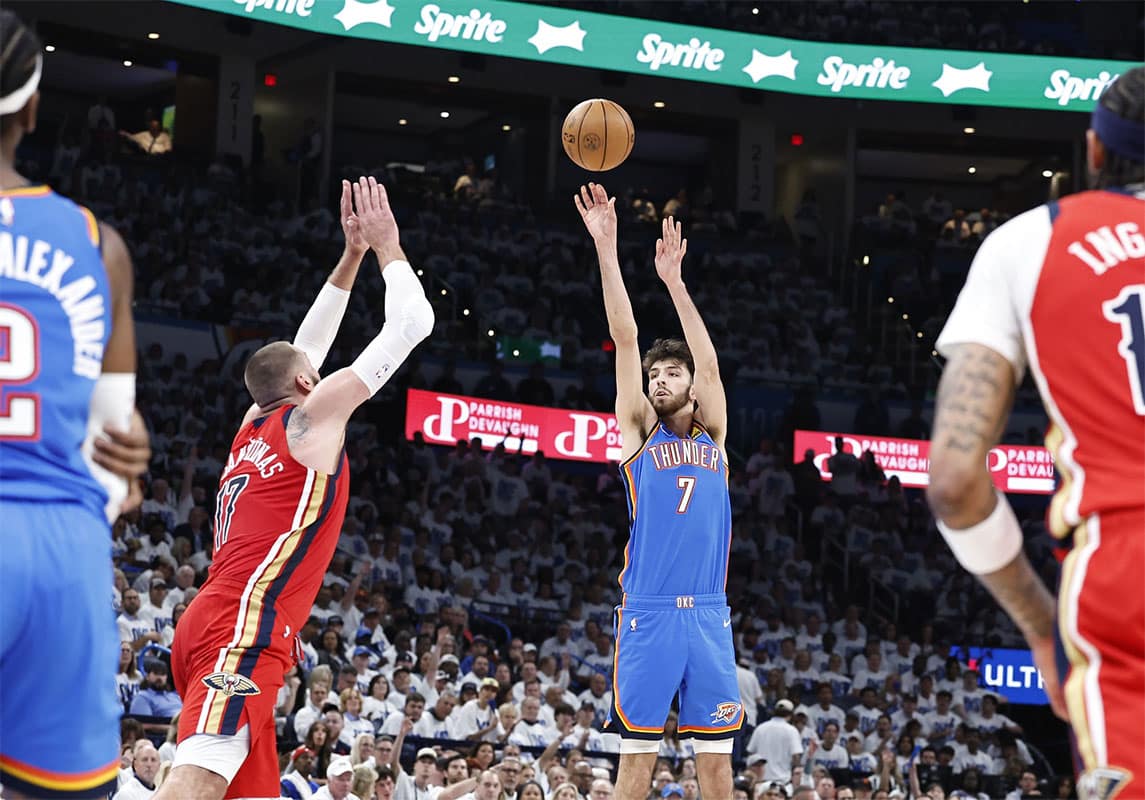 Oklahoma City Thunder forward Chet Holmgren (7) shoots as New Orleans Pelicans center Jonas Valanciunas (17) defends during the second half of game two of the first round for the 2024 NBA playoffs at Paycom Center