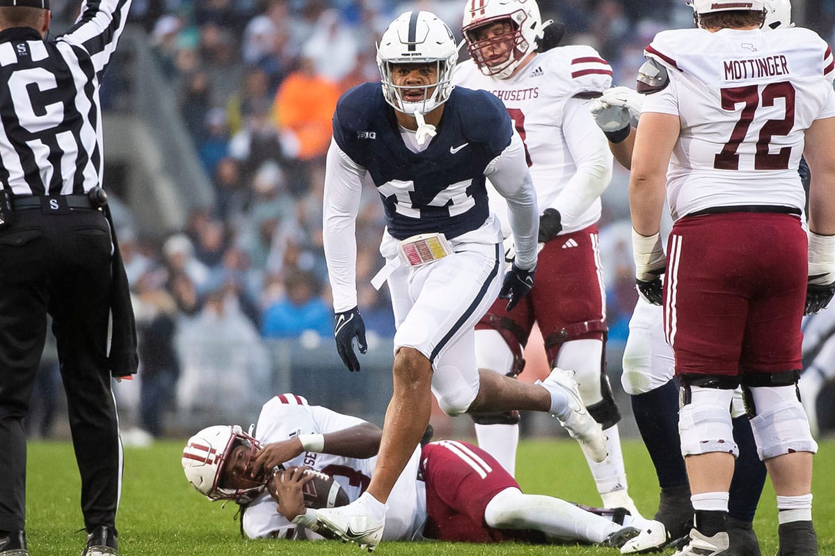 Penn State defensive end Chop Robinson (44) reacts after sacking Massachusetts quarterback Taisun Phommachanh in the first half of a NCAA football game Saturday, Oct. 14, 2023, in State College, Pa. The Nittany Lions won, 63-0.