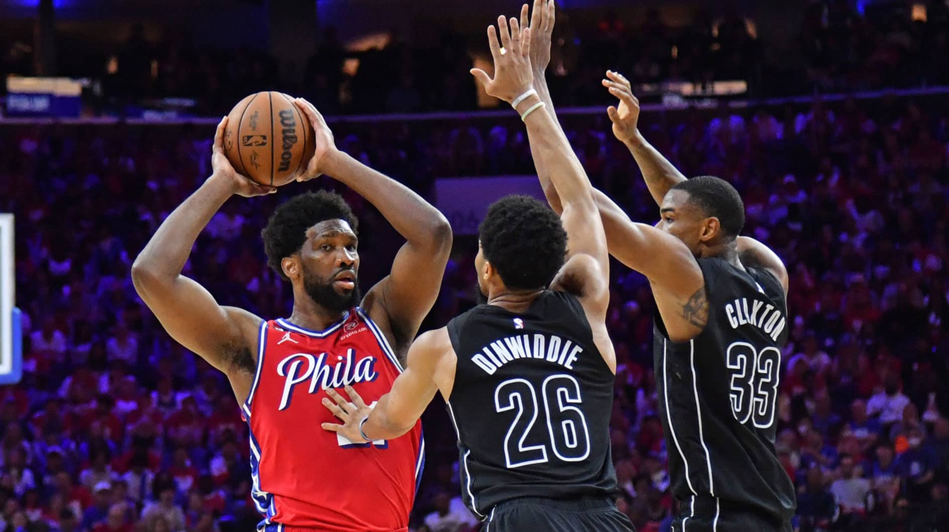 Apr 15, 2023; Philadelphia, Pennsylvania, USA; Philadelphia 76ers center Joel Embiid (21) is double-teamed by Brooklyn Nets guard Spencer Dinwiddie (26) and center Nic Claxton (33) during the third quarter of game one of the 2023 NBA playoffs at Wells Fargo Center. Mandatory Credit: Eric Hartline-USA TODAY Sports