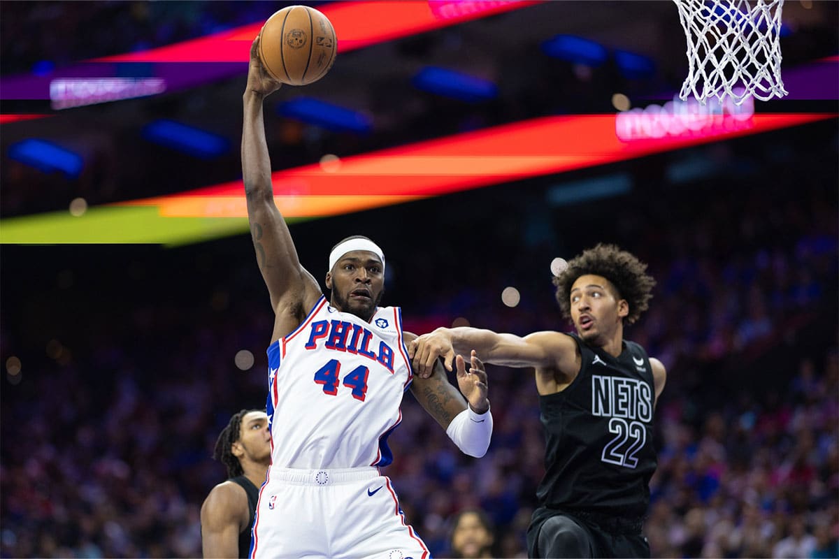 Philadelphia 76ers forward Paul Reed (44) reaches for a ball past Brooklyn Nets forward Jalen Wilson (22) during the fourth quarter at Wells Fargo Center. 