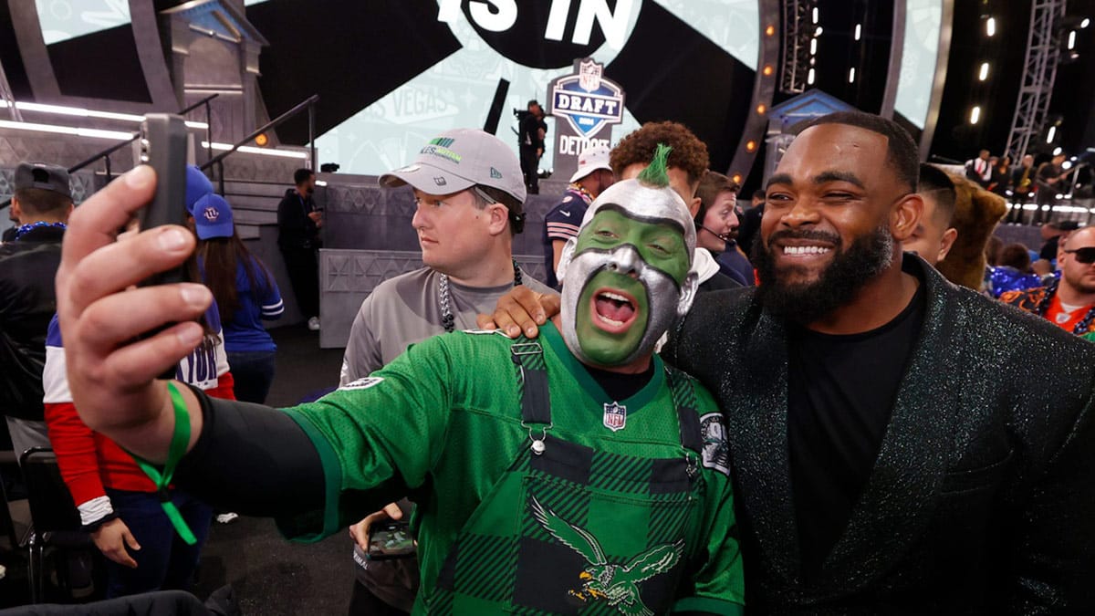 Philadelphia Eagles fan Jamie Pagliei, 51 of Philadelphia, uses FaceTime on his iPhone with Eagles player and former Michigan football player Brandon Graham who announced his teams second round pick in the 2024 NFL draft in Detroit on Friday, April 26, 2024.