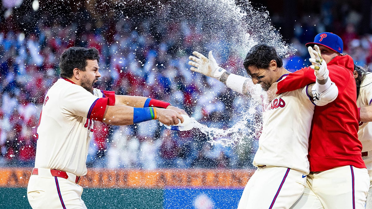 Philadelphia Phillies outfielder Nick Castellanos (8) is douse with water by designated hitter Kyle Schwarber (12) after hitting a walk off RBI single during the ninth inning against the Pittsburgh Pirates at Citizens Bank Park. 