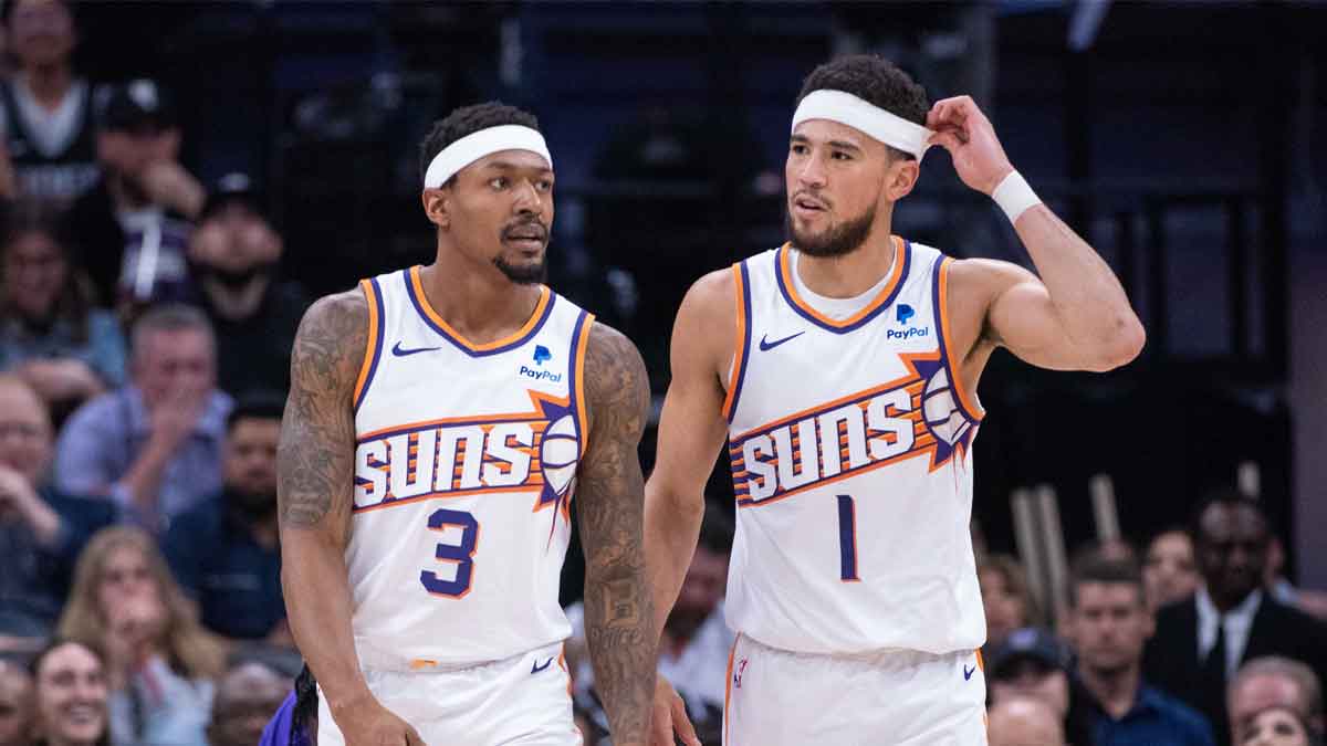 Phoenix Suns guard Bradley Beal (3) and guard Devin Booker (1) walk off the court during a time out in the second quarter against the Sacramento Kings at Golden 1 Center.