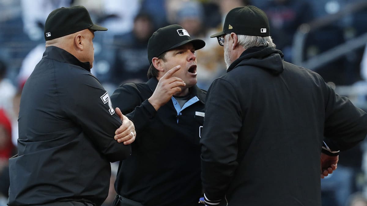 Home plate umpire DJ Reyburn (middle) reacts to Pittsburgh Pirates manager Derek Shelton (right) as fellow umpire Brian O'Nora (7) looks on against the Boston Red Sox during the ninth inning at PNC Park. Boston won 4-2.