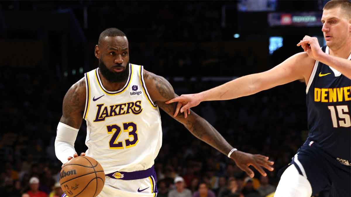 Los Angeles Lakers forward LeBron James (23) drives against Denver Nuggets center Nikola Jokic (15)