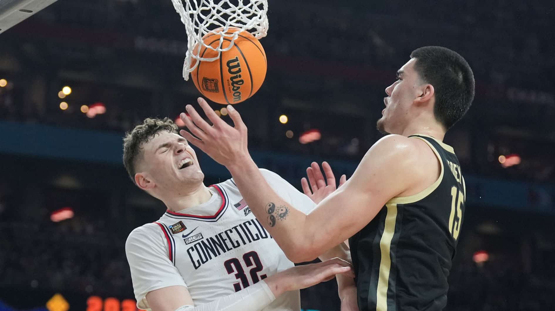 Apr 8, 2024; Glendale, AZ, USA; Purdue Boilermakers center Zach Edey (15) and Connecticut Huskies center Donovan Clingan (32) battle for the ball in the national championship game of the Final Four of the 2024 NCAA Tournament at State Farm Stadium. Mandatory Credit: Robert Deutsch-USA TODAY Sports