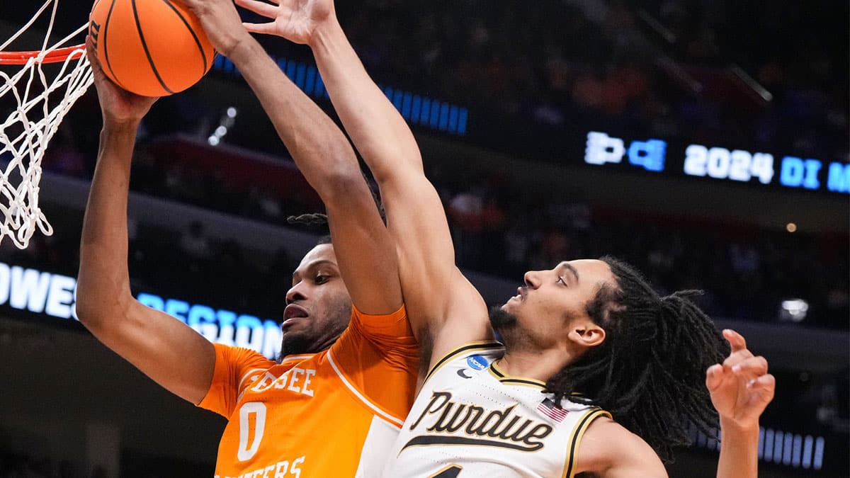 Tennessee Volunteers forward Jonas Aidoo (0) recovers a rebound against Purdue Boilermakers forward Trey Kaufman-Renn (4) on Sunday, March 31, 2024, during the midwest regional finals at the Little Caesars Arena in Detroit