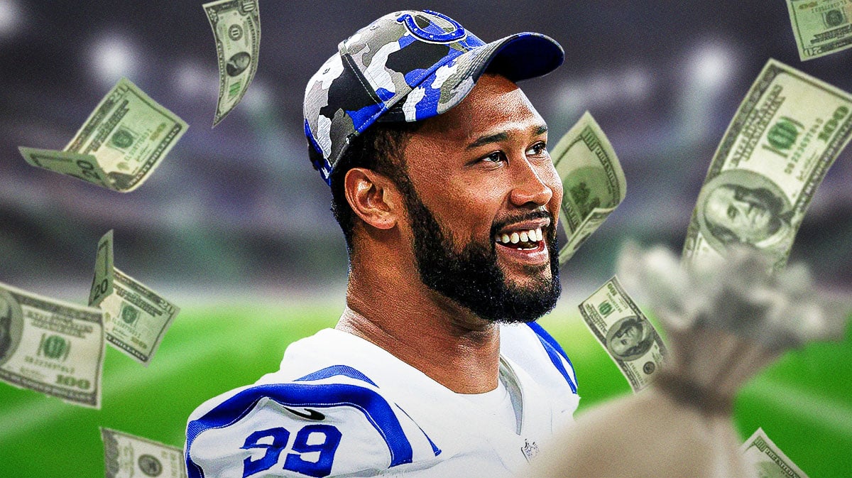 DeForest Buckner with money falling around him
