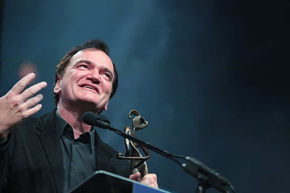 Quentin Tarantino accepting an award at the Palm Springs Film Festival.