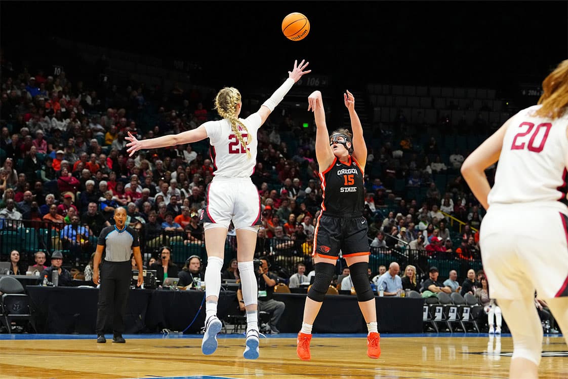 Oregon State Beavers forward Raegan Beers (15) shoots against Stanford Cardinal forward Cameron Brink (22) during the first quarter.