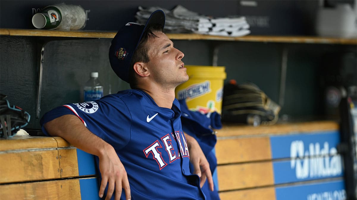 Texas Rangers starting pitcher Jack Leiter (35) sits on the dugout bench after being pulled from the game in his Major League debut against the Detroit Tigers in the fourth inning at Comerica Park.