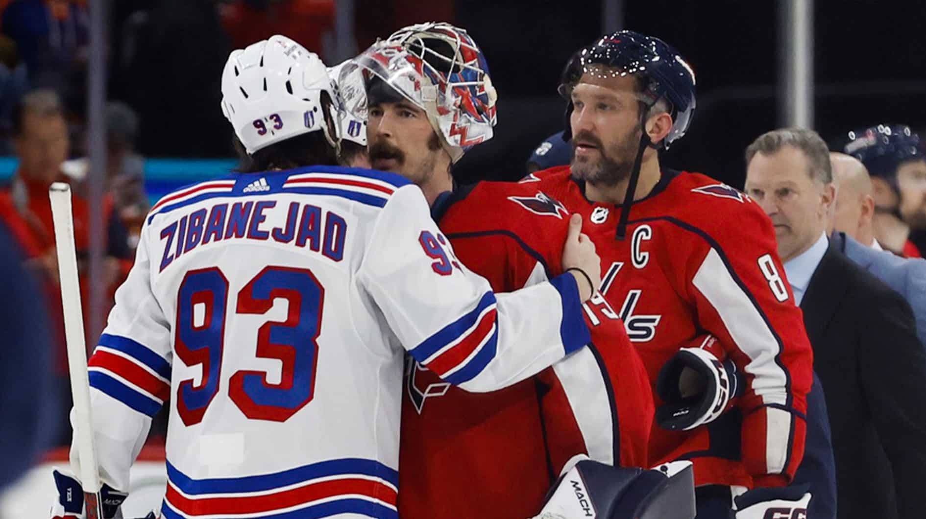 New York Rangers center Mika Zibanejad (93) hugs Washington Capitals goaltender Charlie Lindgren (79) in the handshake line after game four of the first round of the 2024 Stanley Cup Playoffs at Capital One Arena.