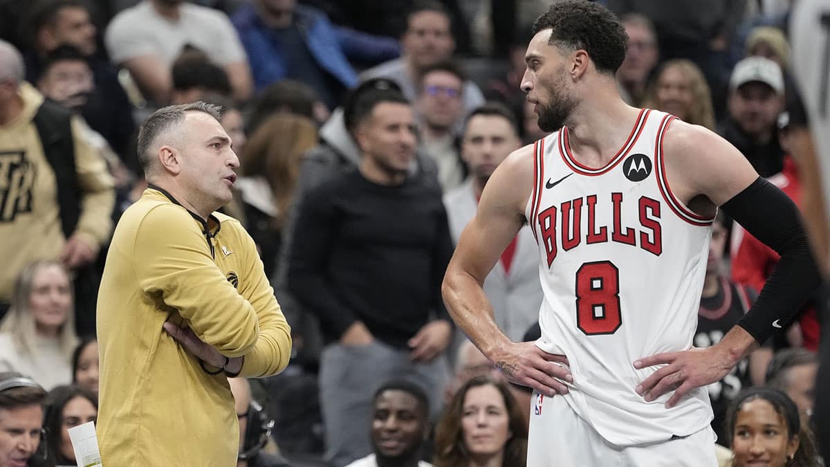 Toronto Raptors head coach Darko Rajakovic talks to Chicago Bulls guard Zach LaVine (8) after Bulls forward DeMar DeRozan was ejected from the game during the second half at Scotiabank Arena