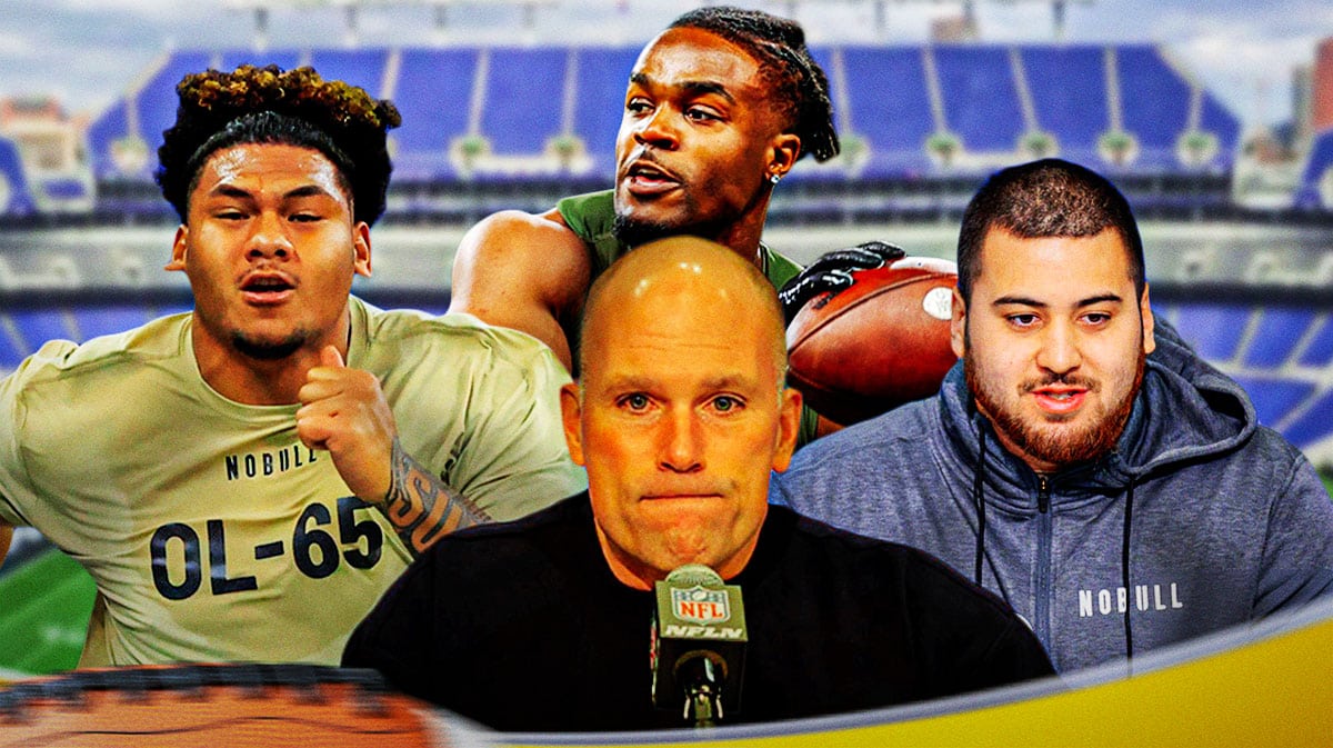 GM Eric DeCosta in the middle, Kingsley Suamataia, Max Melton, Dominick Puni around him, and Baltimore Ravens wallpaper in the background