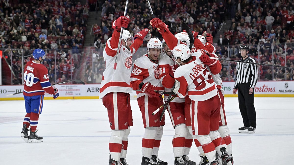  Detroit Red Wings forward David Perron (57) celebrates with teammates after scoring a goal against the Montreal Canadiens during the third period at the Bell Centre. 