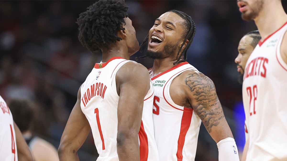 Houston Rockets forward Cam Whitmore (7) celebrates with forward Amen Thompson (1) after a play during the fourth quarter against the San Antonio Spurs at Toyota Center