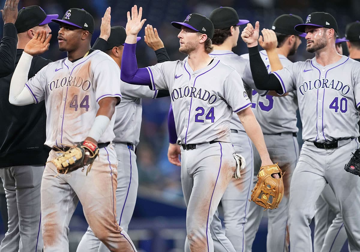 Colorado Rockies third baseman Ryan McMahon (24) celebrates the win with his teammates against the Toronto Blue Jays at the end of the ninth inning at Rogers Centre.