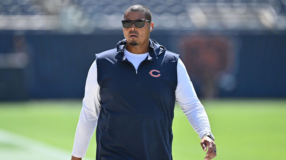 Chicago Bears general manager Ryan Poles walks laps around the field before their game against the Green Bay Packers at Soldier Field