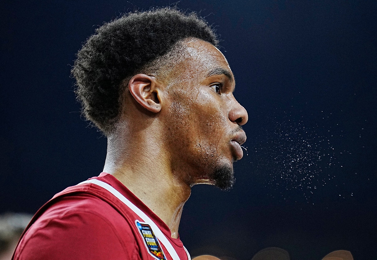 Alabama guard Rylan Griffen (3) spits during the Final Four semifinal game against Connecticut at State Farm Stadium.