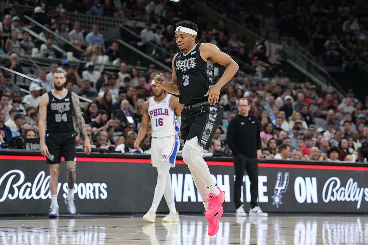 San Antonio Spurs forward Keldon Johnson (3) leaves the court after an injury in the second half against the Philadelphia 76ers at Frost Bank Center. 