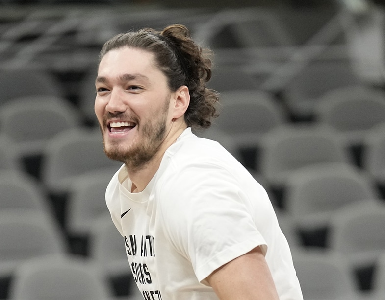 San Antonio Spurs forward Cedi Osman (16) is all smiles during warmups before a game against the New York Knicks at Frost Bank Center. 