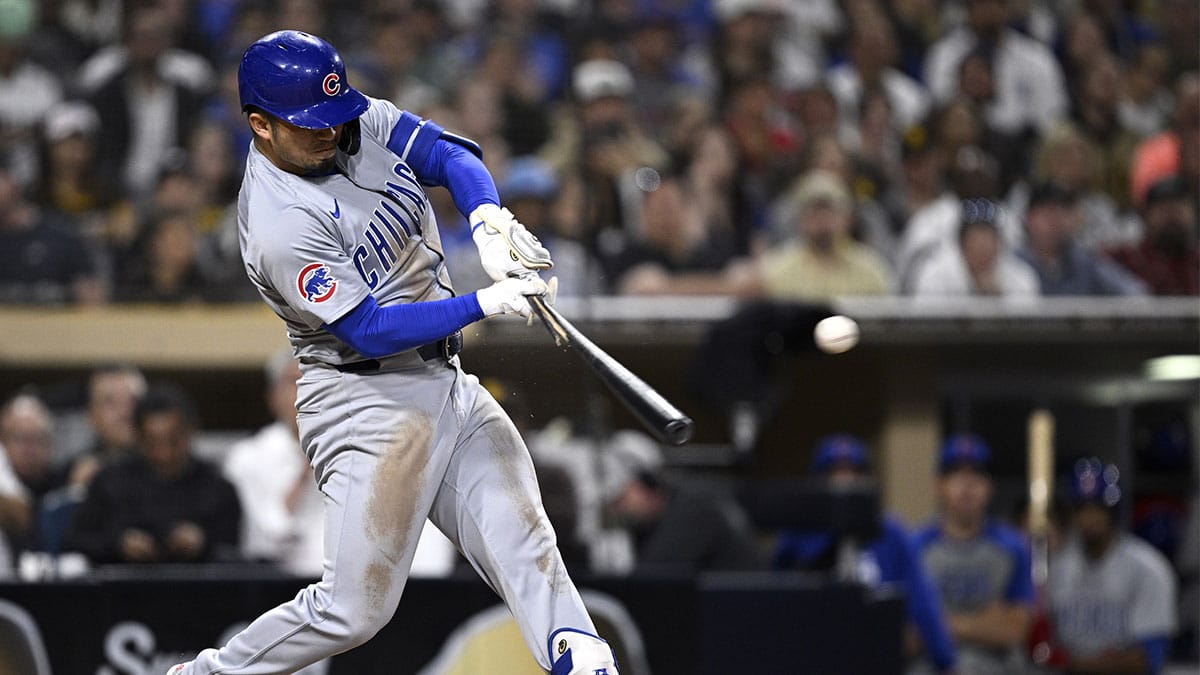Chicago Cubs right fielder Seiya Suzuki (27) hits a single against the San Diego Padres during the third inning at Petco Park.