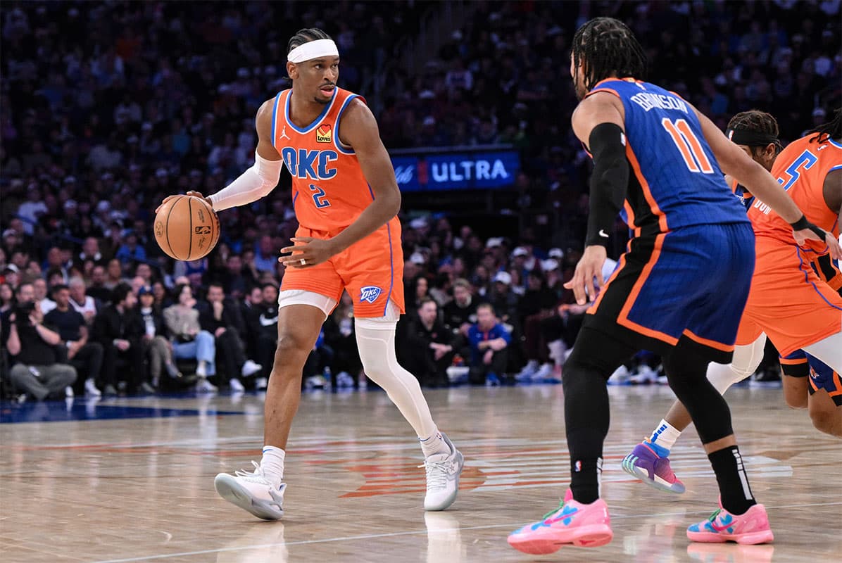 Oklahoma City Thunder guard Shai Gilgeous-Alexander (2) sets the play while being defended by New York Knicks guard Jalen Brunson (11) during the third quarter at Madison Square Garden