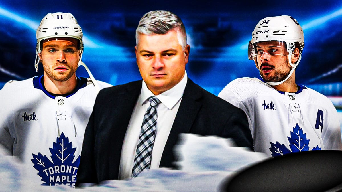 Sheldon Keefe in middle of image looking angry, Max Domi and Auston Matthews on either side looking stern, Toronto Maple Leafs logo, hockey rink in background