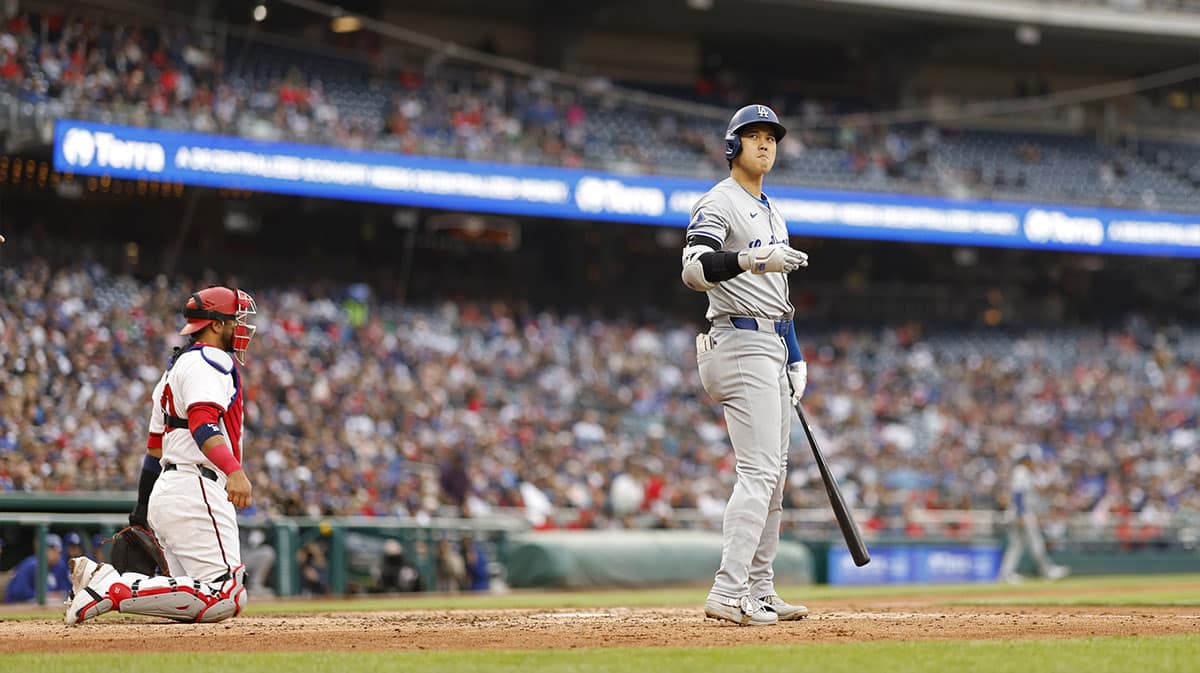 Los Angeles Dodgers designated hitter Shohei Ohtani (17) reacts to missing a pitch against the Washington Nationals during the eighth inning at Nationals Park.