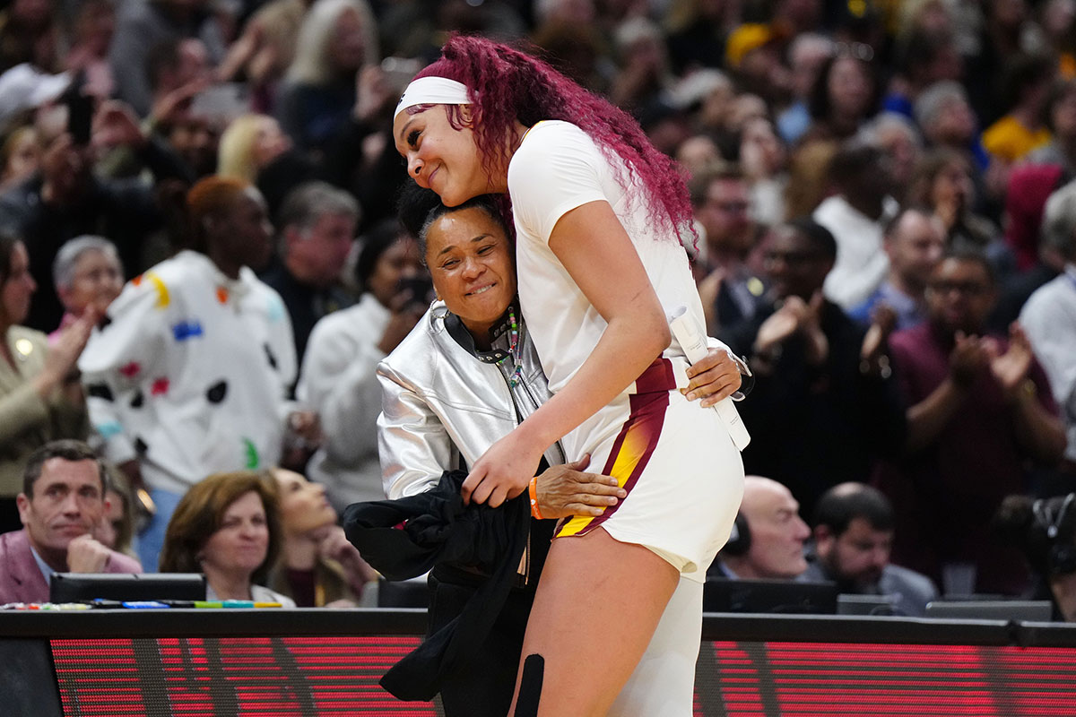 Apr 7, 2024; Cleveland, OH, USA; South Carolina Gamecocks center Kamilla Cardoso (10) embraces head coach Dawn Staley in the fourth quarter against the Iowa Hawkeyes in the finals of the Final Four of the womens 2024 NCAA Tournament at Rocket Mortgage FieldHouse. Mandatory Credit: Kirby Lee-USA TODAY Sports