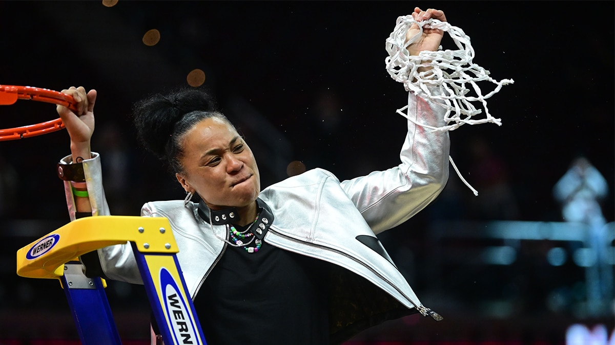 Apr 7, 2024; Cleveland, OH, USA; South Carolina Gamecocks head coach Dawn Staley cuts the net after defeating the Iowa Hawkeyes in the finals of the Final Four of the womens 2024 NCAA Tournament at Rocket Mortgage FieldHouse. Mandatory Credit: Ken Blaze-USA TODAY Sports