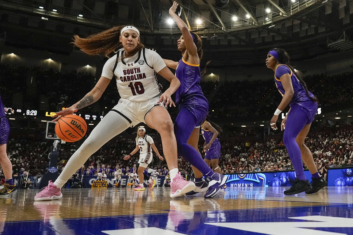 South Carolina Gamecocks center Kamilla Cardoso (10) works the ball toward the basket against LSU Lady Tigers forward Angel Reese (10) during the second half.