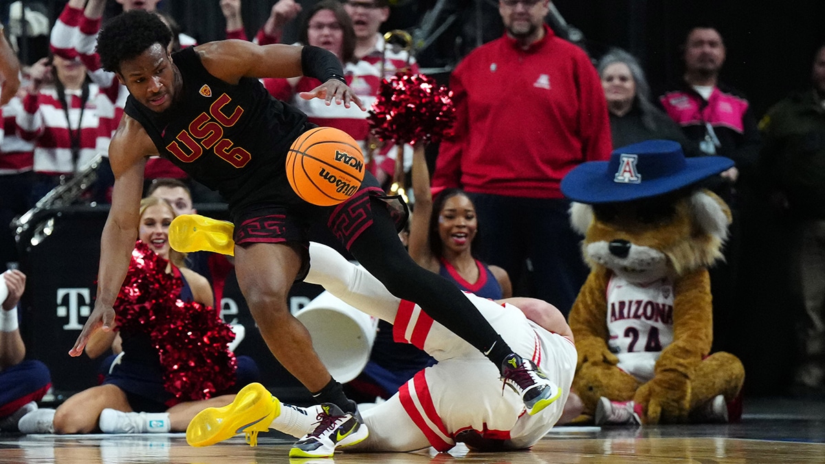 Mar 14, 2024; Las Vegas, NV, USA; Southern California Trojans guard Bronny James (6) and Arizona Wildcats guard Pelle Larsson (3) battle for the ball in the first half at T-Mobile Arena. Mandatory Credit: Kirby Lee-USA TODAY Sports