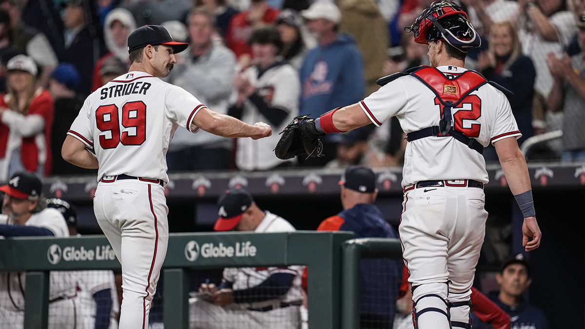 Atlanta Braves starting pitcher Spencer Strider (99) reacts with catcher Sean Murphy (12) after retiring the Miami Marlins during the eighth inning at Truist Park