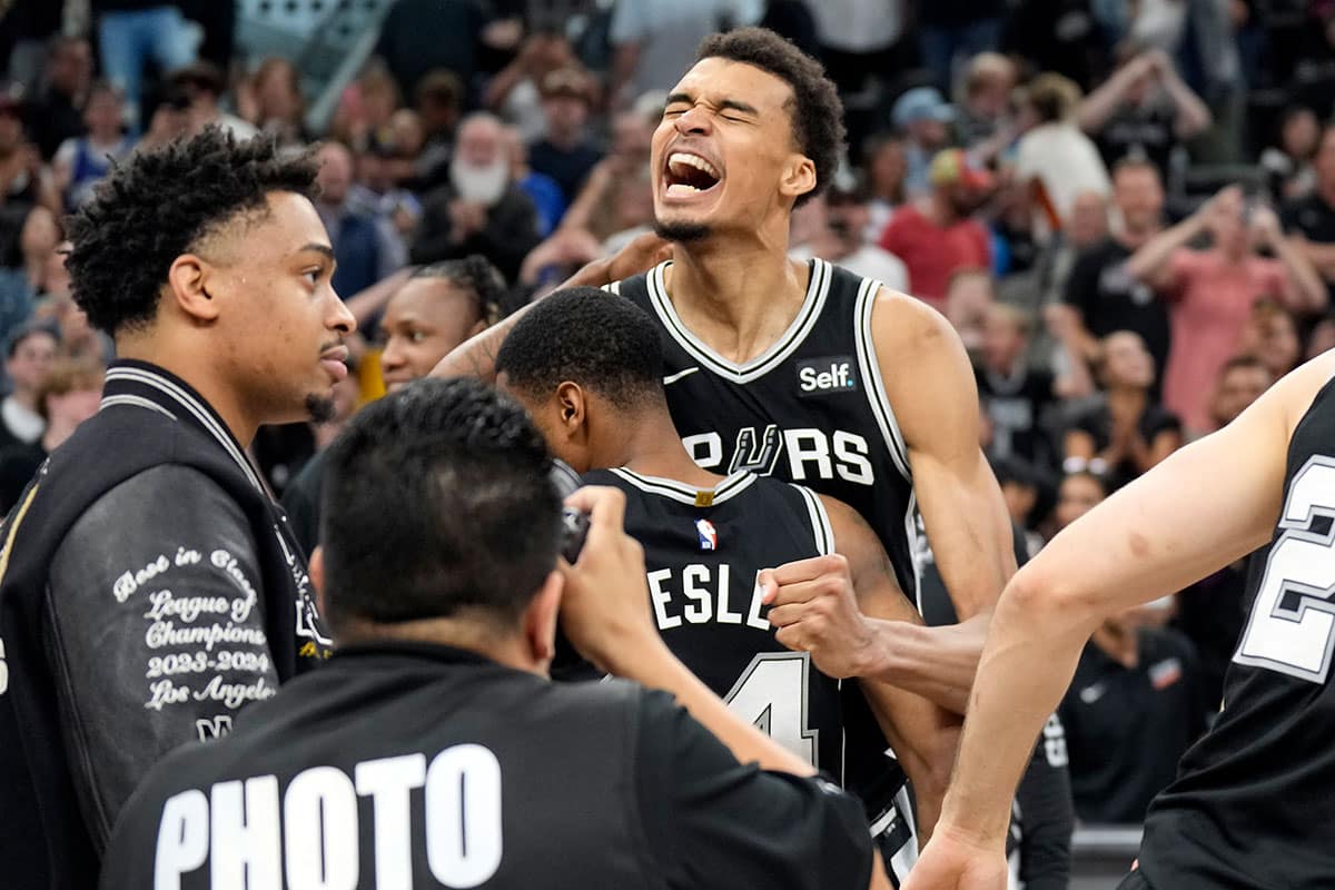 San Antonio Spurs forward Victor Wembanyama (1) and teammates react after a victory over the Denver Nuggets at Frost Bank Center.