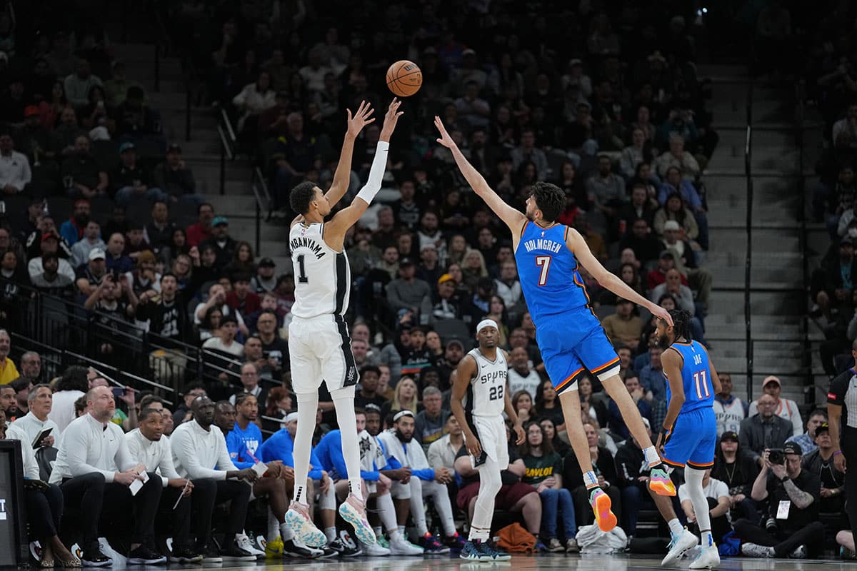 San Antonio Spurs center Victor Wembanyama (1) shoots over Oklahoma City Thunder forward Chet Holmgren (7) in the second half at Frost Bank Center.
