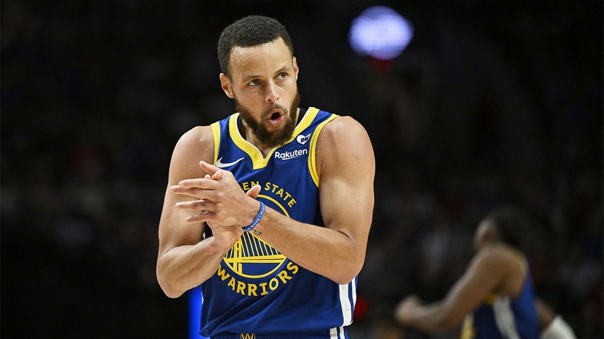 Golden State Warriors guard Stephen Curry (30) claps his hands in celebration during the second half against the Portland Trail Blazers at Moda Center.