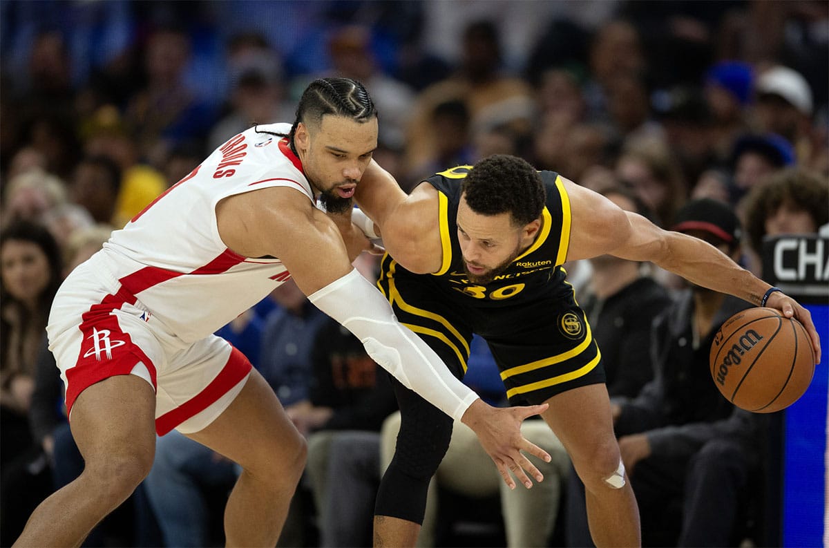 Houston Rockets guard Dillon Brooks (9) guards Golden State Warriors guard Stephen Curry (30) during the fourth quarter at Chase Center. 