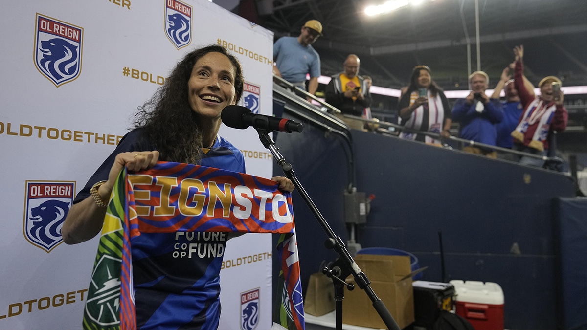 Sue Bird asks for fans to put their scarves up before the game against the Orlando Pride.