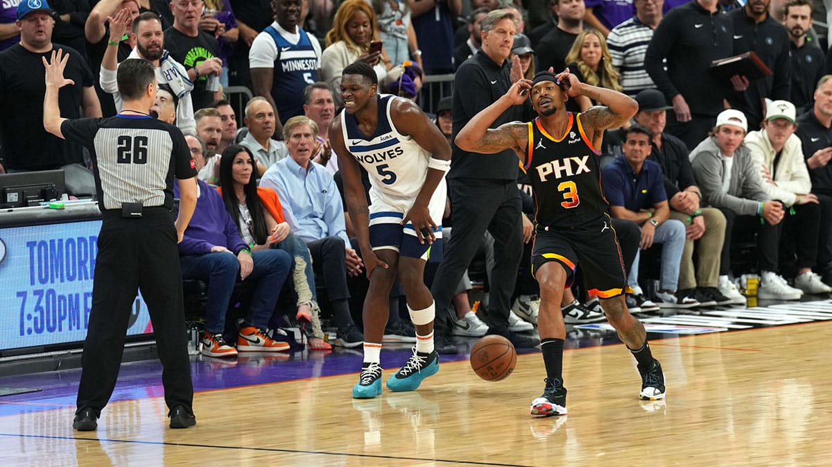 Phoenix Suns guard Bradley Beal (3) reacts in front of Minnesota Timberwolves guard Anthony Edwards (5) and referee Pat Fraher (26) after fouling out during the second half of game four of the first round for the 2024 NBA playoffs at Footprint Center.