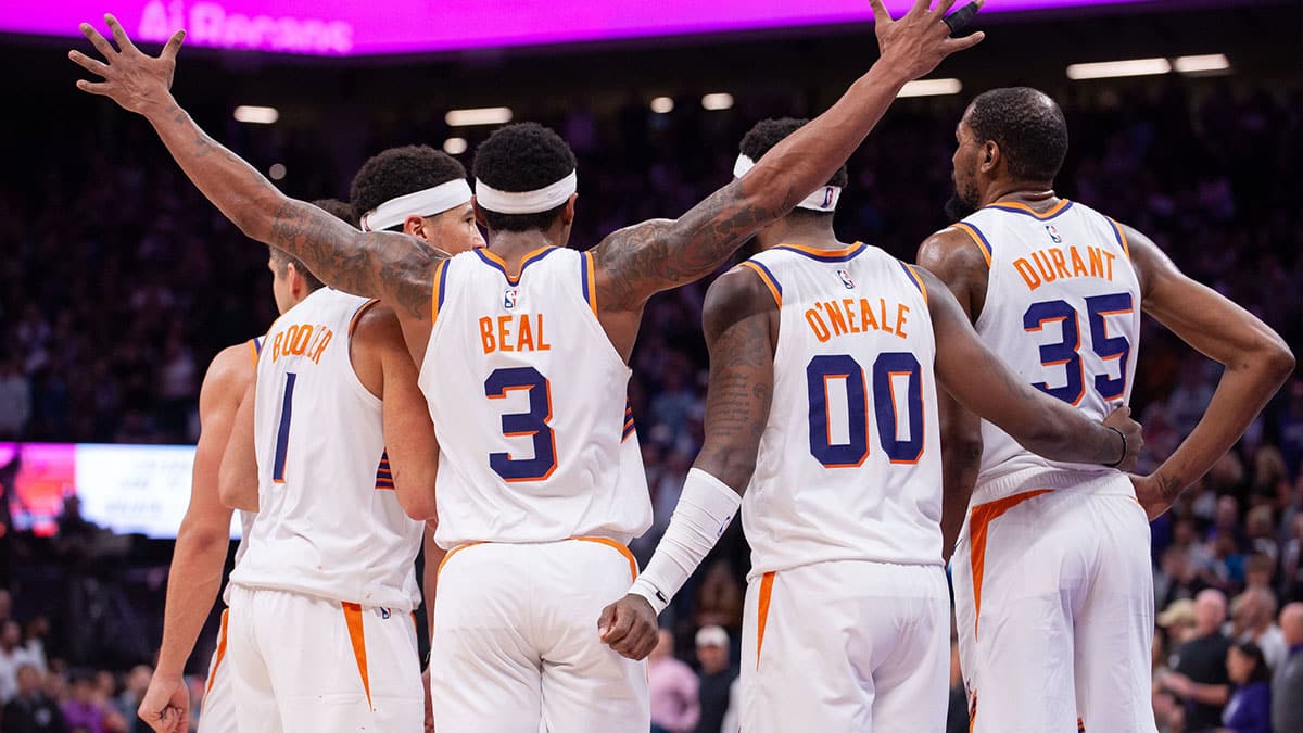 Phoenix Suns guard Grayson Allen (8) and guard Devin Booker (1) and guard Bradley Beal (3) and forward Royce O'Neale (00) and forward Kevin Durant (35) huddle up before the final seconds of the fourth quarter at Golden 1 Center.