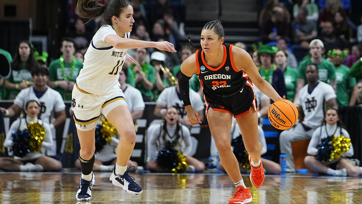 Oregon State Beavers guard Talia von Oelhoffen (22) dribbles the ball against Notre Dame Fighting Irish guard Sonia Citron (11) during the second half in the semifinals of the Albany Regional of the 2024 NCAA Tournament 