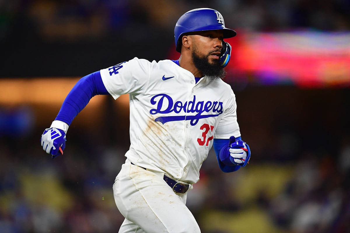 Los Angeles Dodgers right fielder Teoscar Hernandez (37) runs after hitting a single against the San Diego Padres during the seventh inning at Dodger Stadium.