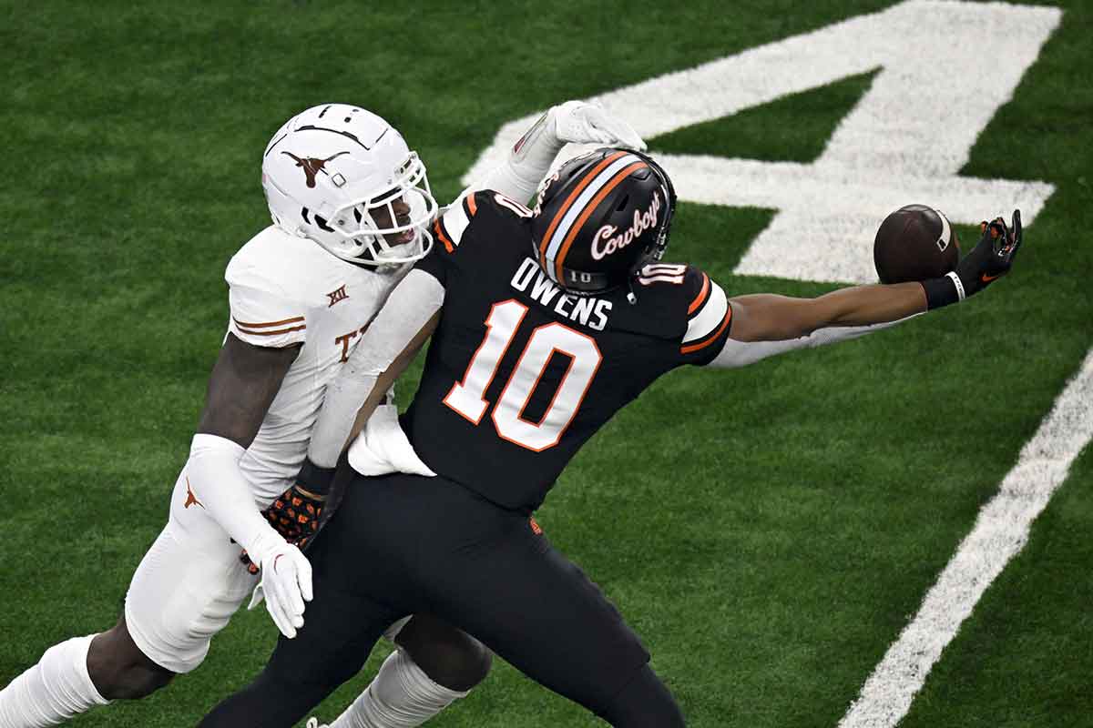 Dec 2, 2023; Arlington, TX, USA; Texas Longhorns defensive back Terrance Brooks (8) breaks up a pass intended for Oklahoma State Cowboys wide receiver Rashod Owens (10) during the first quarter at AT&T Stadium. Mandatory Credit: Jerome Miron-USA TODAY Sports